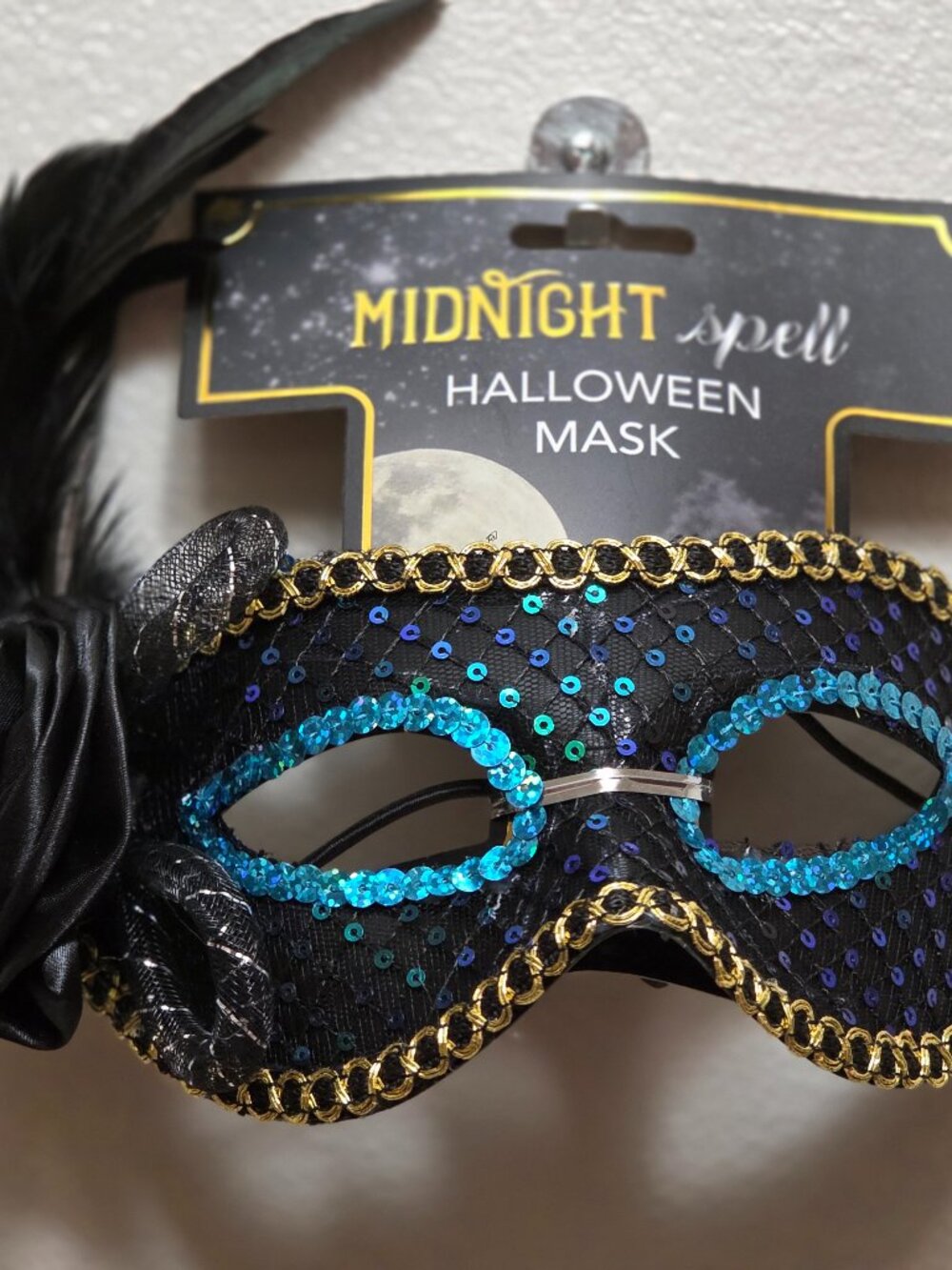 Black Spooky Village Masquerade Mask featuring vibrant blue sequin trim